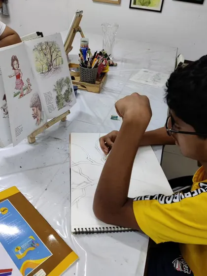 A teen student learns to draw and paint a complex tree structure, focusing on the fundamentals of form and color.