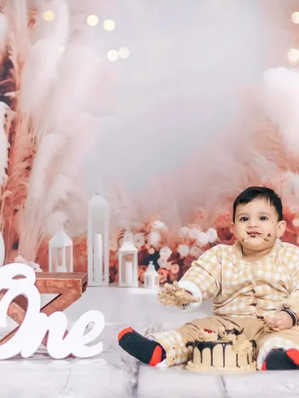 A candid shot of a cake smash in progress. We love capturing these unscripted, messy, and joyful moments during our first birthday studio sessions.