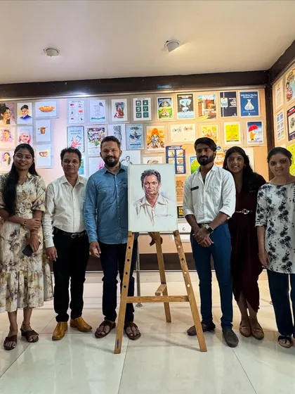 Another group of students and faculty with the completed portrait.