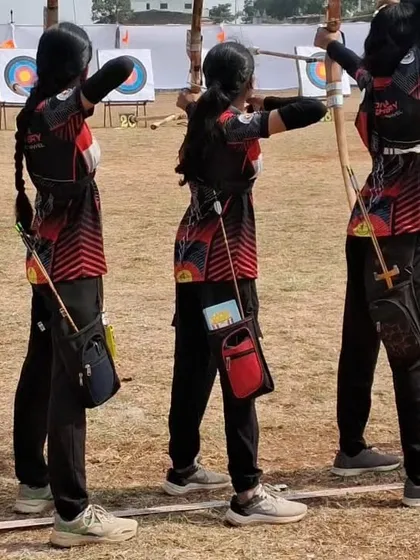 Our girls' team shooting in unison with their Indian wooden bows during the Mini State Archery Championship.