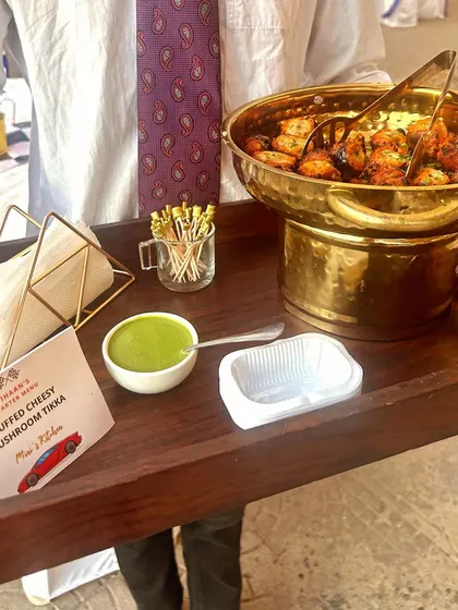 A close-up of the Stuffed Cheesy Mushroom Tikka, a popular vegetarian starter for any event.