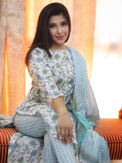 Here you can see how this comfortable cotton suit is perfect for a relaxed, seated look. Style is about feeling good in what you wear, and this outfit is the definition of effortless comfort.