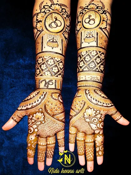 An engagement henna design featuring interlocking rings and the couple's initials. I also included the engagement date, 18-1-2024, to make it extra special.