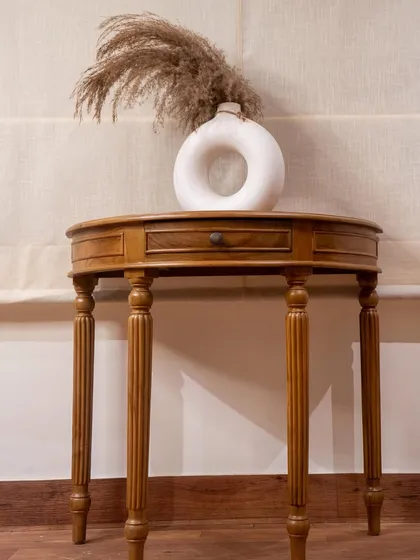 Craftsmanship is in the details. This custom-made teak console table features gracefully turned and carved legs, showing a more classic side of my work. It’s a versatile piece that can serve as a study desk, an entryway table, or a display cabinet.