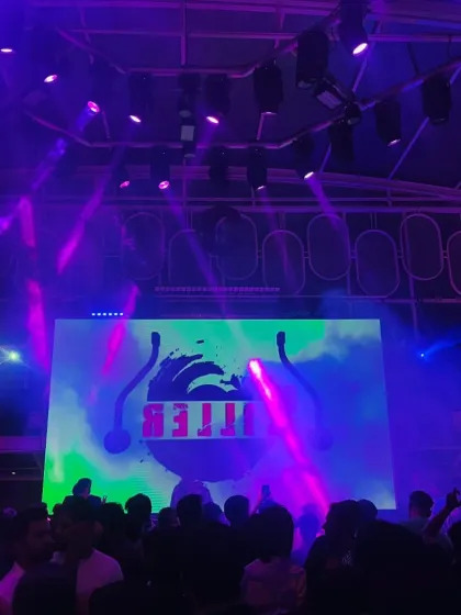 The stage setup before the crowd rushes in. My custom "KILL3R" visuals are a key part of my branding and the overall club aesthetic I bring.