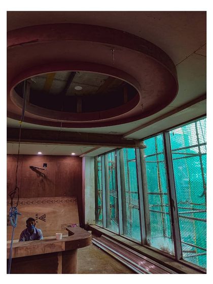 An in-progress shot from a hospital site, showing the installation of a circular stretch ceiling light. This behind-the-scenes view reveals the structural work that underpins our finished designs.