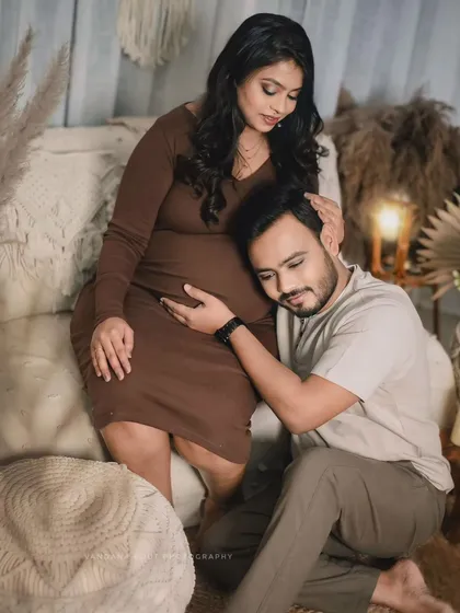 An intimate moment from a boho-themed studio session, where the father-to-be listens lovingly to the baby bump. These are the quiet, heartfelt memories I aim to preserve.