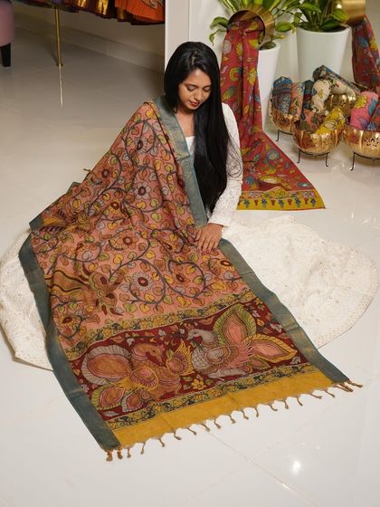 This is a glimpse into my Kalamkari Edition, featuring a wide array of hand-painted dupattas and fabrics from the Indralokam series. Each piece is a unique story, available for you to customize into your dream outfit.