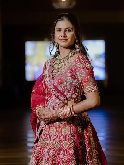 A full portrait of Yaksha's stunning wedding look. The makeup was designed to be flawless both up close and from a distance, balancing her intricate outfit and jewelry.