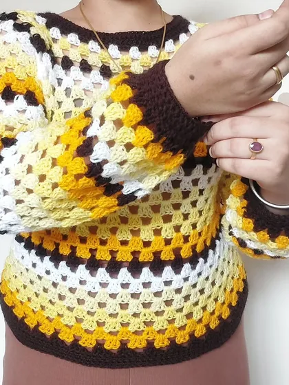 The balloon sleeves with fitted cuffs are a key feature of this cozy Trinity Sweater.