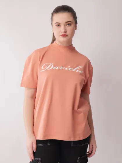 A direct, front-facing shot of the model, providing a clear and straightforward view of the t-shirt for online shoppers.