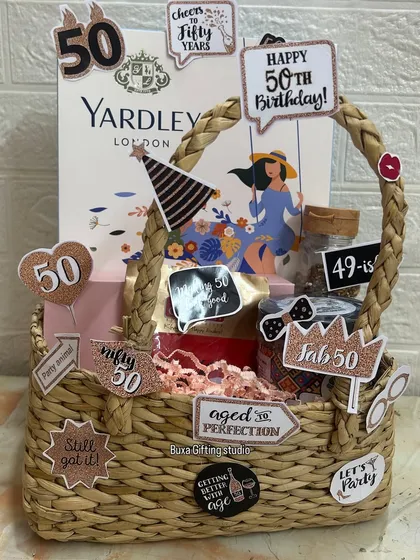 Fifty and fabulous deserves a special celebration. I designed this fun-filled hamper with cheeky "aged to perfection" cutouts, indulgent mukhwas, a glam set from Enn Beauty, and a classic Yardley London gift set to honor this incredible milestone.