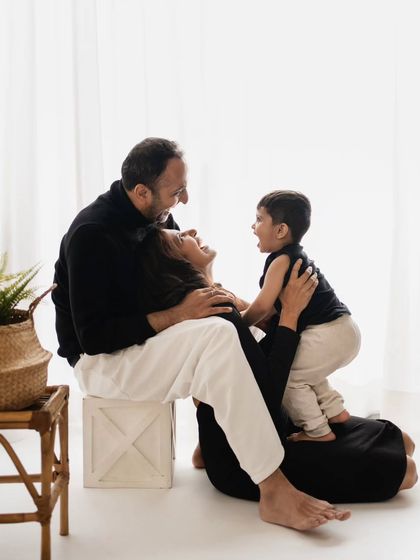 A playful interaction between mother and son, filled with laughter and energy, showcasing the fun we have in the studio.