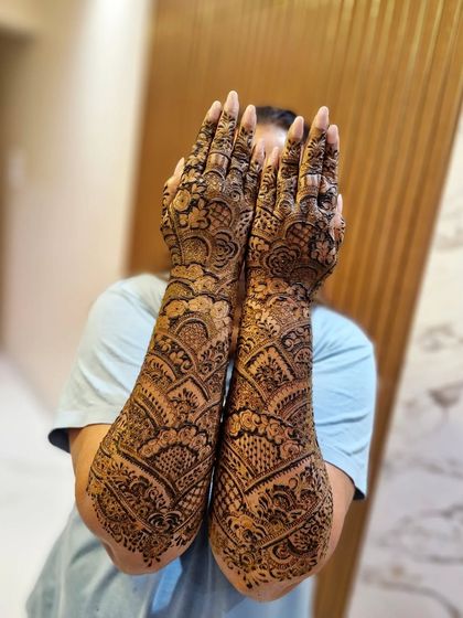 A full-arm design with a modern, flowing pattern that uses arcs and scallops for a unique and eye-catching effect.