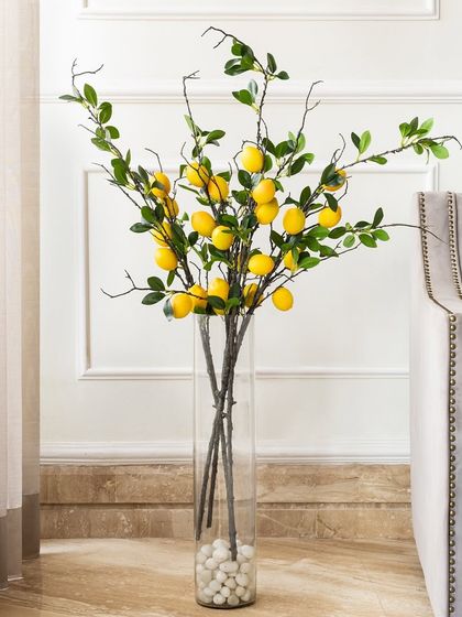 For something a little different, I love these artificial lemon stems. They bring a fresh, Mediterranean vibe to your home and look wonderful in a tall glass vase.