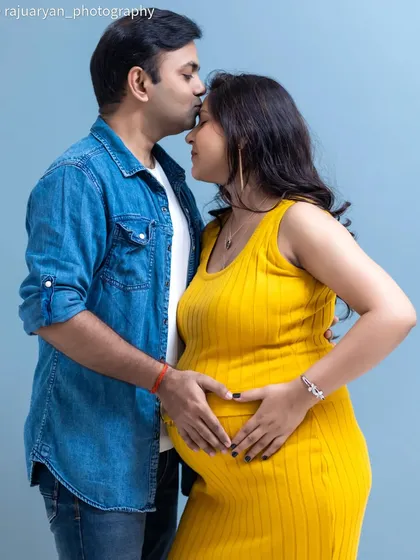 Sometimes, the most powerful photos are the simplest. In this intimate studio portrait, I focused on the couple's connection, with their hands forming a heart on the baby bump. The clean background keeps the attention on their love and anticipation.