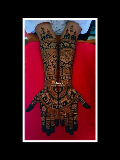 For the bride who loves classic elegance, I create intricate, full-coverage mehendi without figures. This South Indian bridal design features traditional motifs like elephants and lotuses, with dense patterns that provide a rich, dark stain.