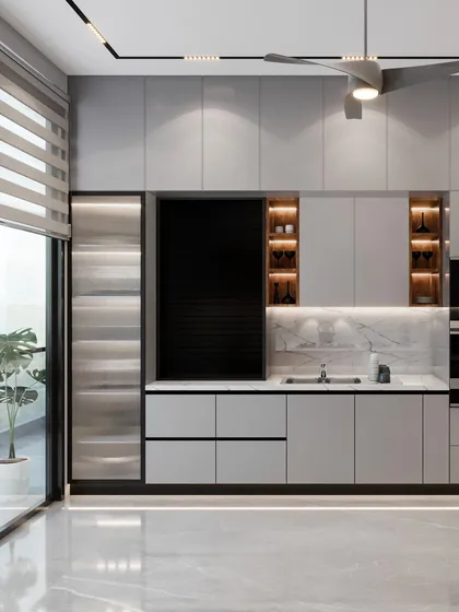 In our Amaryllis project, we designed the kitchen with a monochromatic gray scheme and minimalist feel. Decorative display shelves outside the main kitchen area help maintain aesthetic equilibrium.
