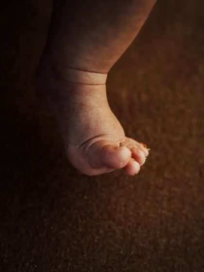 A close-up, artistic shot of a newborn's tiny feet. I focus on capturing these precious details that change so quickly in the first few weeks of life.