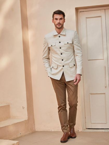 The full look, pairing the sepia-toned shacket with slim-fit chinos for a sharp, contemporary silhouette.