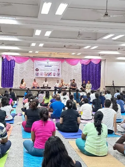Our panel of teachers sharing their wisdom during the International Yoga Day celebration. We believe in learning from many sources and fostering a space for open discussion and knowledge sharing.