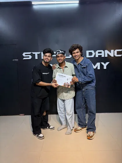 Presenting the completion certificate to Nikhil. He is now ready to take the next step in his dance journey.