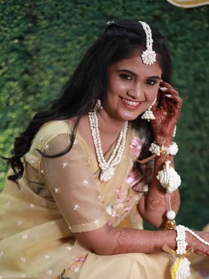 A happy bride-to-be at her Haldi ceremony. I created a very subtle, skin-like base with minimal makeup to let her natural glow and happiness shine through.