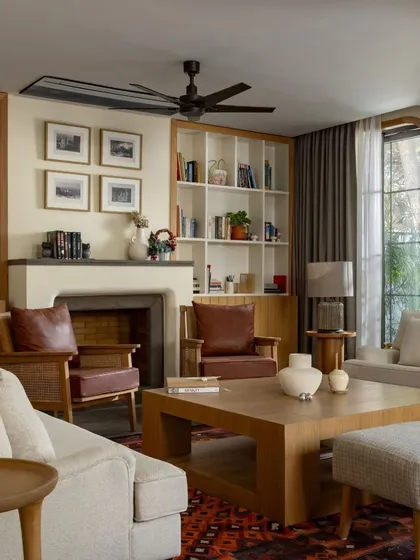 This living room from the House of Continuity shows our passion for restorative architecture. By reconfiguring the layout and enlarging the windows, we transformed an existing structure into a warm, inviting home that honors its past while embracing modern living.