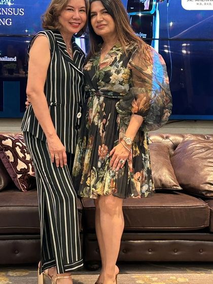 Networking with an international colleague at the APAC 2025 Consensus Meeting. These connections are invaluable for fostering a global community of aesthetic experts.