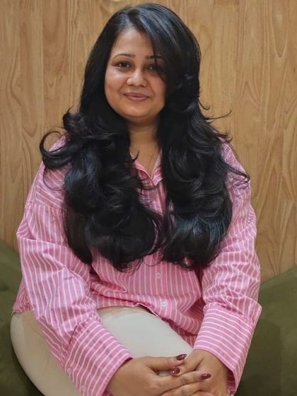 A full view of the beautiful layers and styling. This haircut is perfect for adding body to long hair while maintaining its length, creating a glamorous and healthy look.