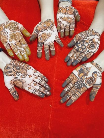 A collection of hands showing the different mehendi designs my team created for the bride's family and friends.