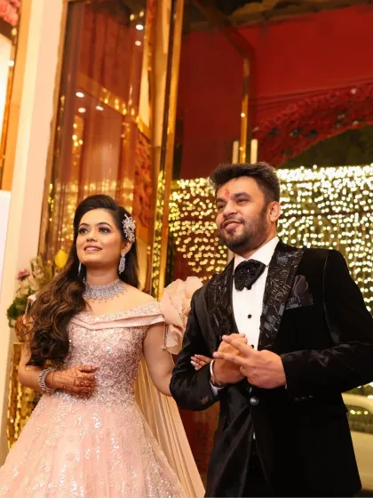 A candid shot of the couple. The bride's makeup is subtle and radiant, allowing her natural happiness to shine through.