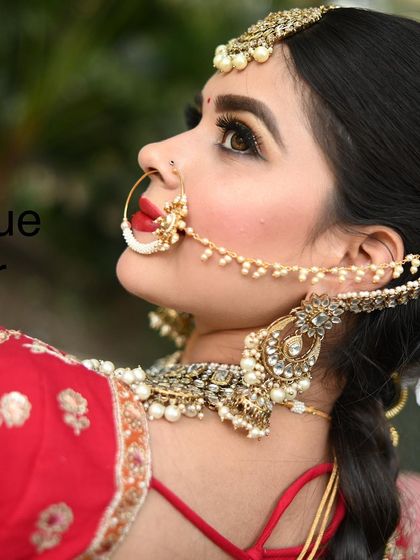 A detailed shot of the bridal makeup and jewellery. The classic nath and choker are essential parts of the bridal sets I offer for rent.