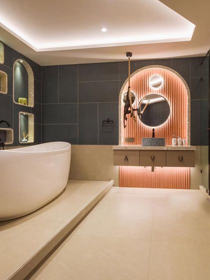 The 'before and after' of the bubble-inspired kids' bathroom. The transformation shows how we created a fun yet stylish space with a new layout, custom niches, and modern fixtures.