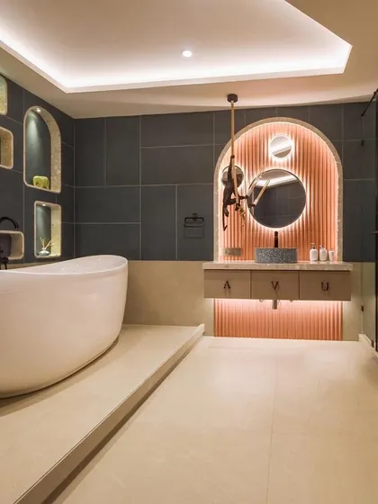 The 'before and after' of the bubble-inspired kids' bathroom. The transformation shows how we created a fun yet stylish space with a new layout, custom niches, and modern fixtures.