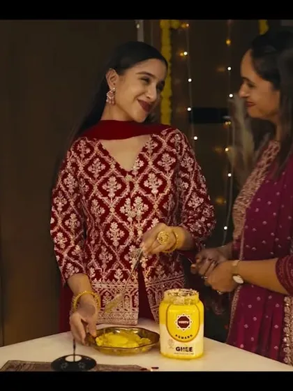 A heartwarming scene from the ad film. The makeup for all the women is consistent in its natural and radiant style, creating a cohesive look.