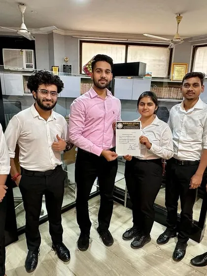 Presenting a certificate to Chesta, surrounded by her peers. Our monthly batches create a strong sense of camaraderie and shared accomplishment.