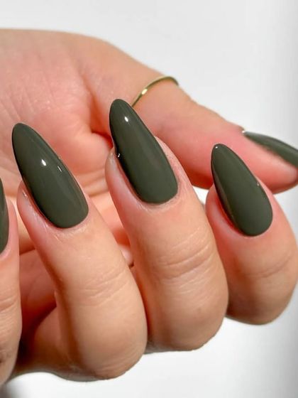 A deep olive green on almond nails. This is such a sophisticated and fashionable color choice.