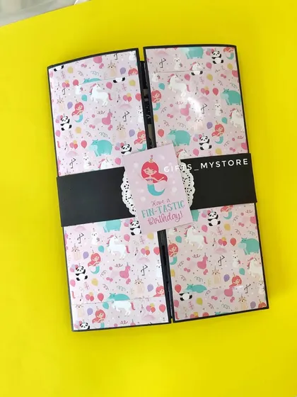 The cute unicorn and mermaid themed cover of a handmade album, perfect for a young girl's birthday.