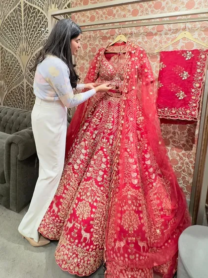 Another masterpiece from Rachit Khanna. This classic red bridal lehenga with intricate zardozi and thread work is perfect for the bride who wants a truly regal look.