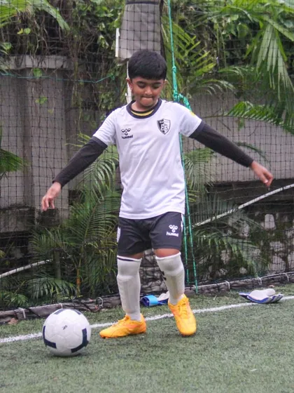 A player prepares to take a shot, demonstrating the focus and preparation that goes into every action on the field.