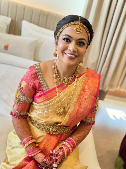A happy bride ready for her big day. The makeup is natural and enhances her features, making her feel confident and beautiful.