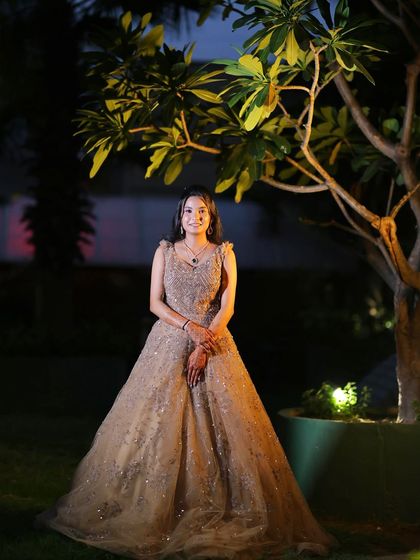 A full-length shot in a garden setting, perfect for pre-wedding photoshoots.