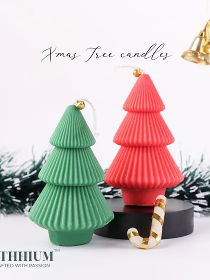 My Christmas tree candle set of two, in classic red and green, comes in a festive gift box.
