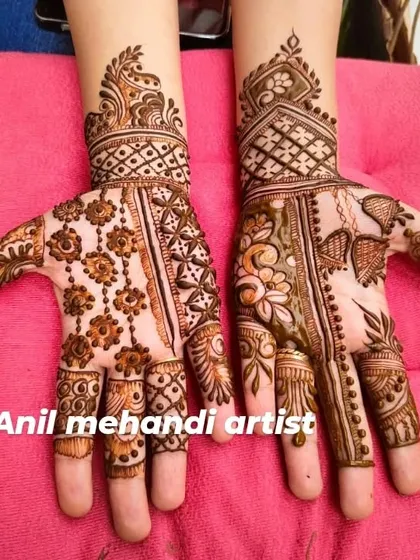 Another view of a stylish party mehandi design. The combination of floral chains and leafy patterns on the right hand is particularly elegant.