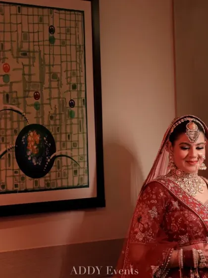 A quiet, contemplative moment for the bride before her ceremony, her gentle smile reflecting the beautiful journey ahead.