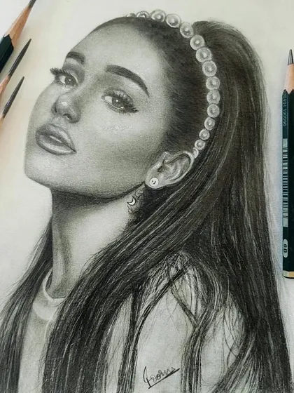 A realistic graphite portrait of Ariana Grande. I focused on capturing her distinct features and the soft texture of her hair, using professional Faber-Castell pencils for a smooth, lifelike finish.