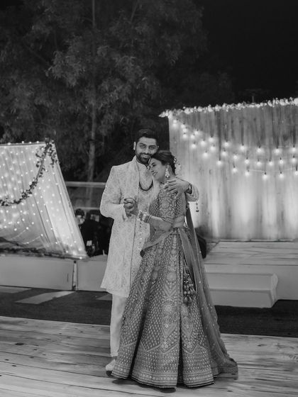 A quiet dance. This black and white shot has a timeless, classic feel, focusing on the couple's graceful movement and connection.