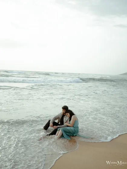 A quiet moment as the waves wash over their feet in Goa. This image captures the peaceful and romantic feeling of being by the sea together.