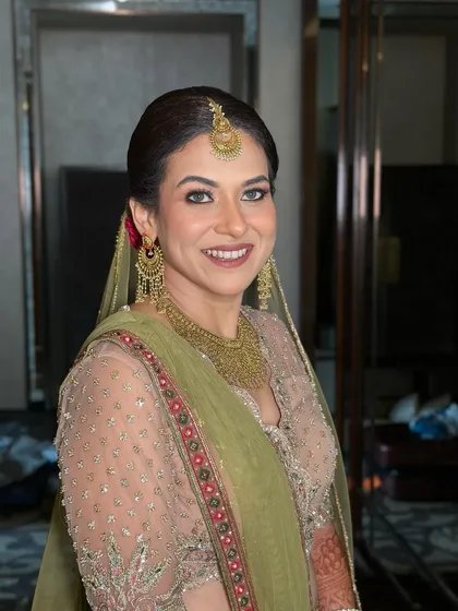 A happy, smiling portrait, her joy is infectious and her makeup looks perfect.